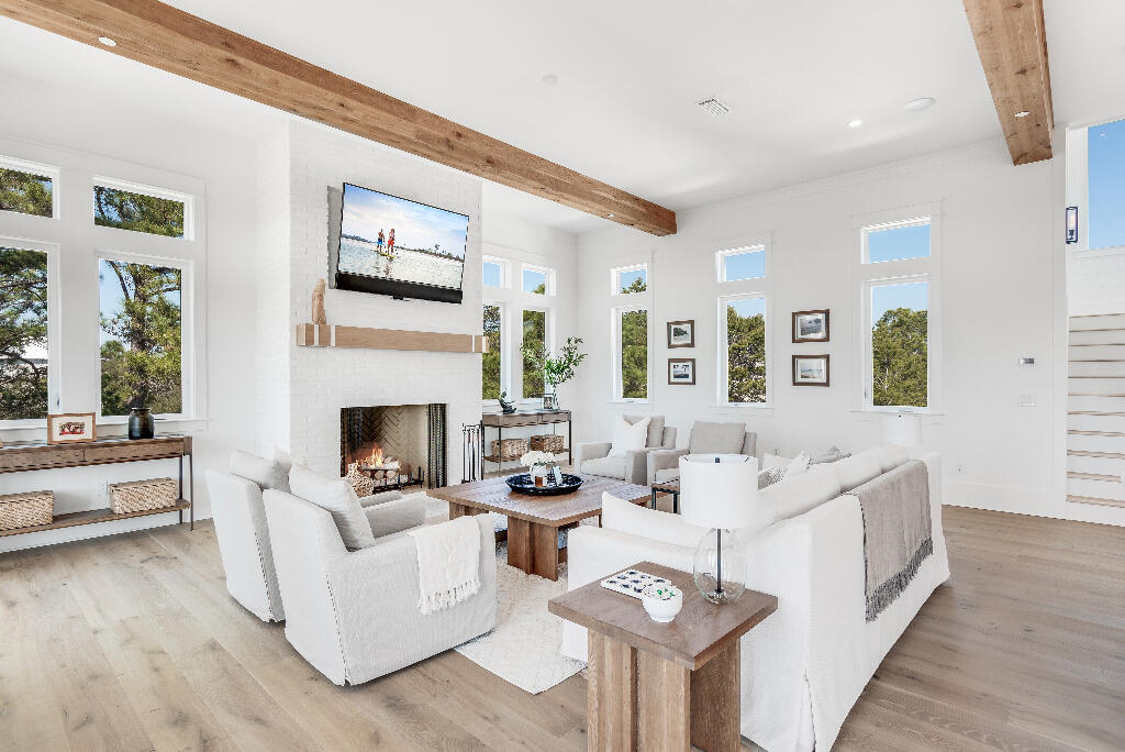 90 Sandstone Street Santa Rosa Beach, FL 32459 - Photo 41 of 73 a living room with furniture and a fireplace