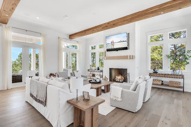 a kitchen with stainless steel appliances a stove a sink and a refrigerator with wooden floor