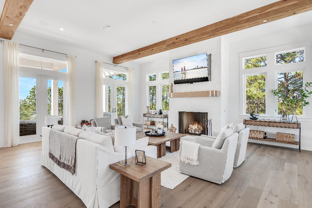 90 Sandstone Street Santa Rosa Beach, FL 32459 - Photo 42 of 73 a living room with furniture and a fireplace