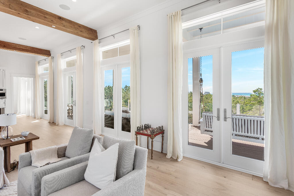 90 Sandstone Street Santa Rosa Beach, FL 32459 - Photo 44 of 73 a living room with furniture and a porch