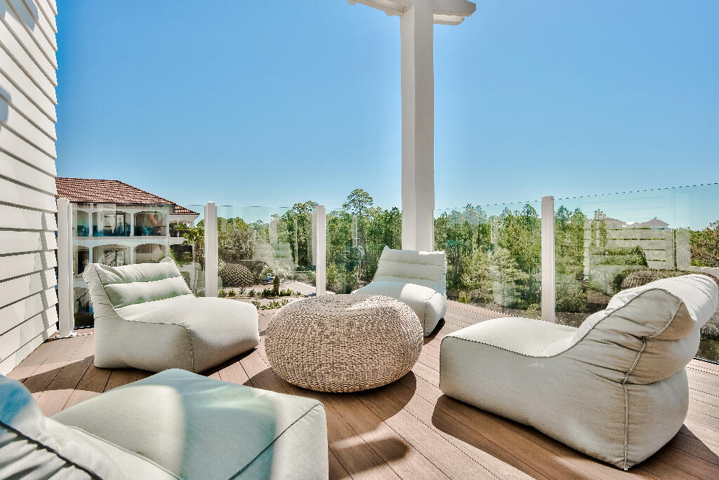 90 Sandstone Street Santa Rosa Beach, FL 32459 - Photo 50 of 73 a living room with furniture and a floor to ceiling window