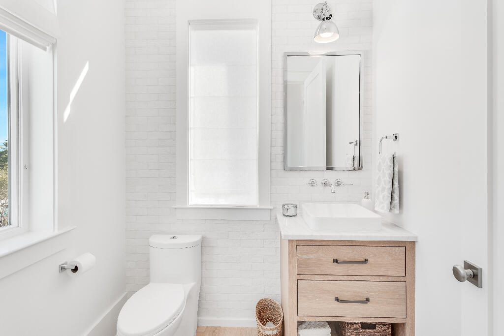 90 Sandstone Street Santa Rosa Beach, FL 32459 - Photo 57 of 73 a bathroom with a sink vanity mirror and toilet