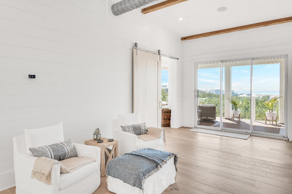 90 Sandstone Street Santa Rosa Beach, FL 32459 - Photo 59 of 73 a living room with furniture and a large window