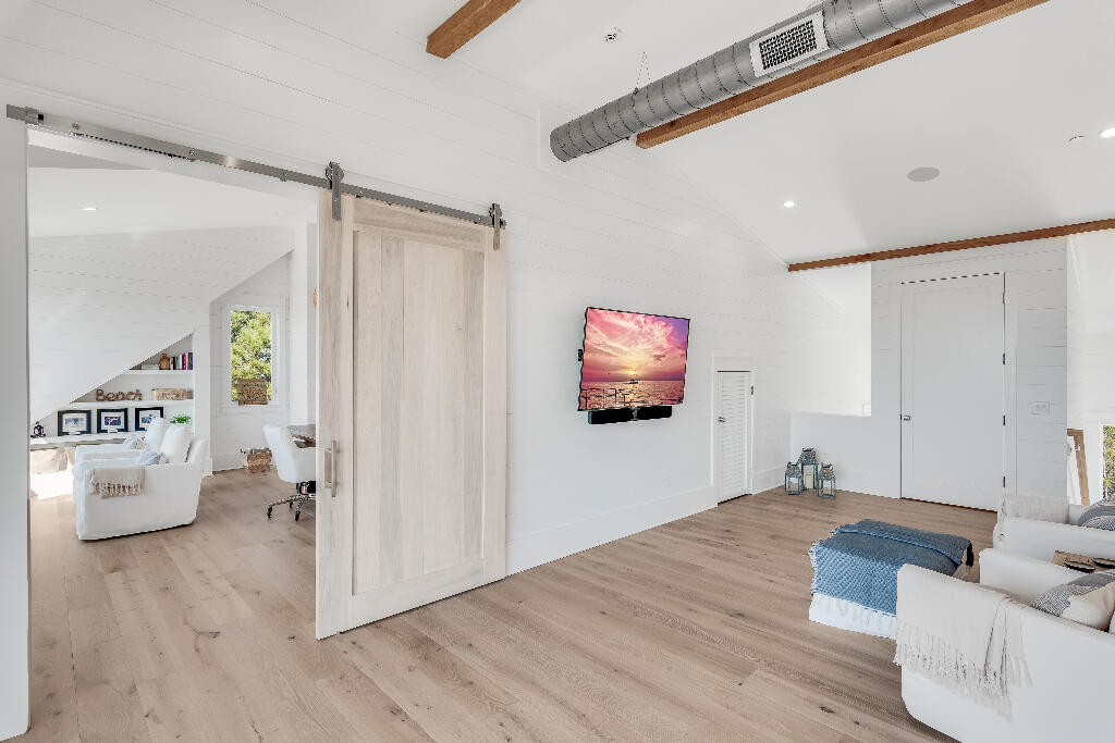 90 Sandstone Street Santa Rosa Beach, FL 32459 - Photo 64 of 73 a living room with furniture and a flat screen tv