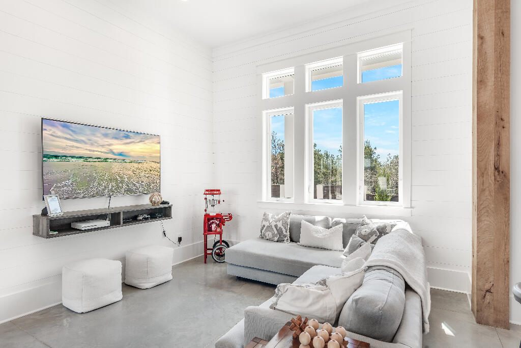 90 Sandstone Street Santa Rosa Beach, FL 32459 - Photo 10 of 73 a living room with furniture and a flat screen tv