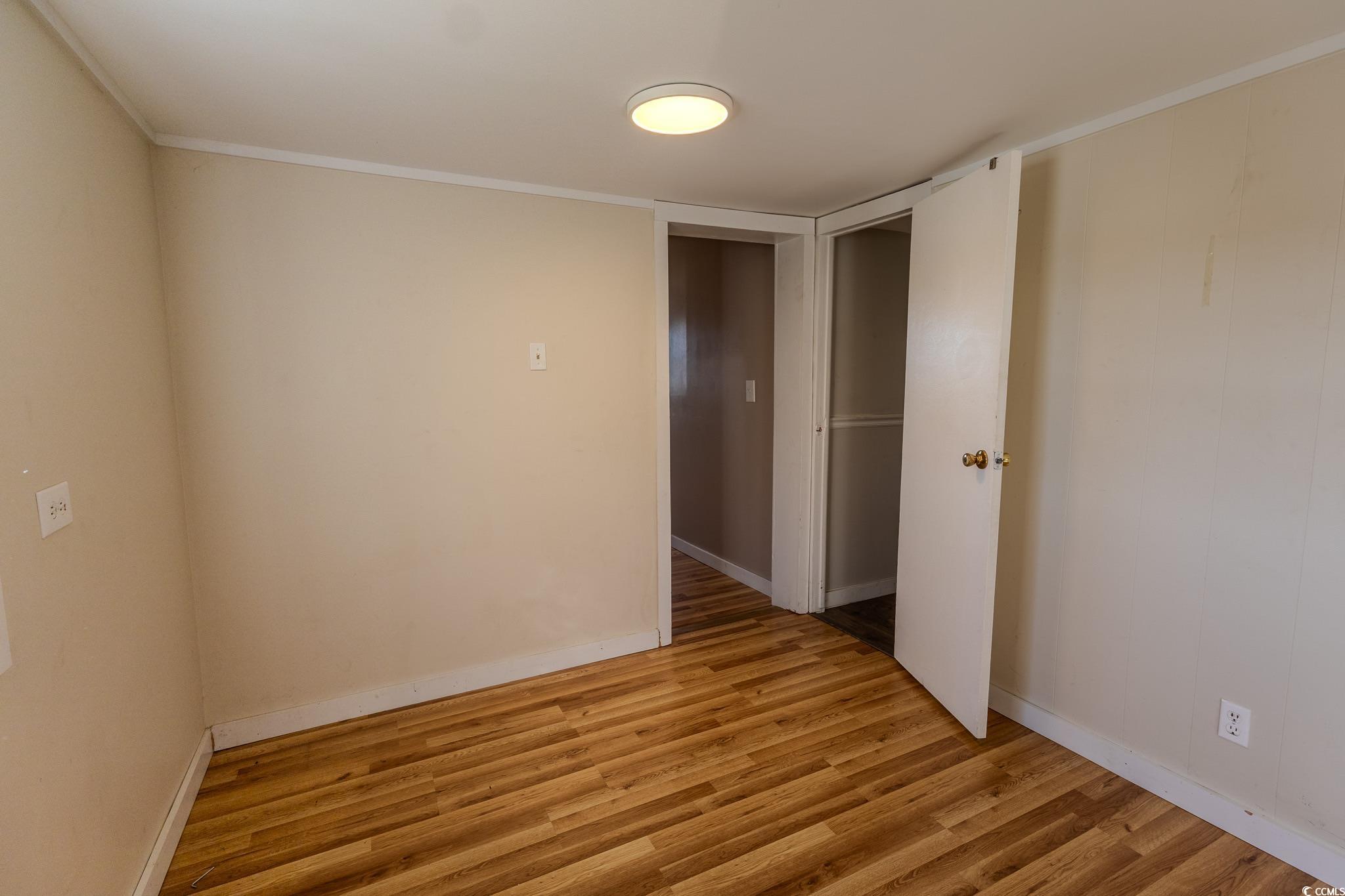7755 Hunting Swamp Road Conway, SC 29527 - Photo 11 of 19 Bathroom featuring curtained shower, vanity, and light wood finished floors