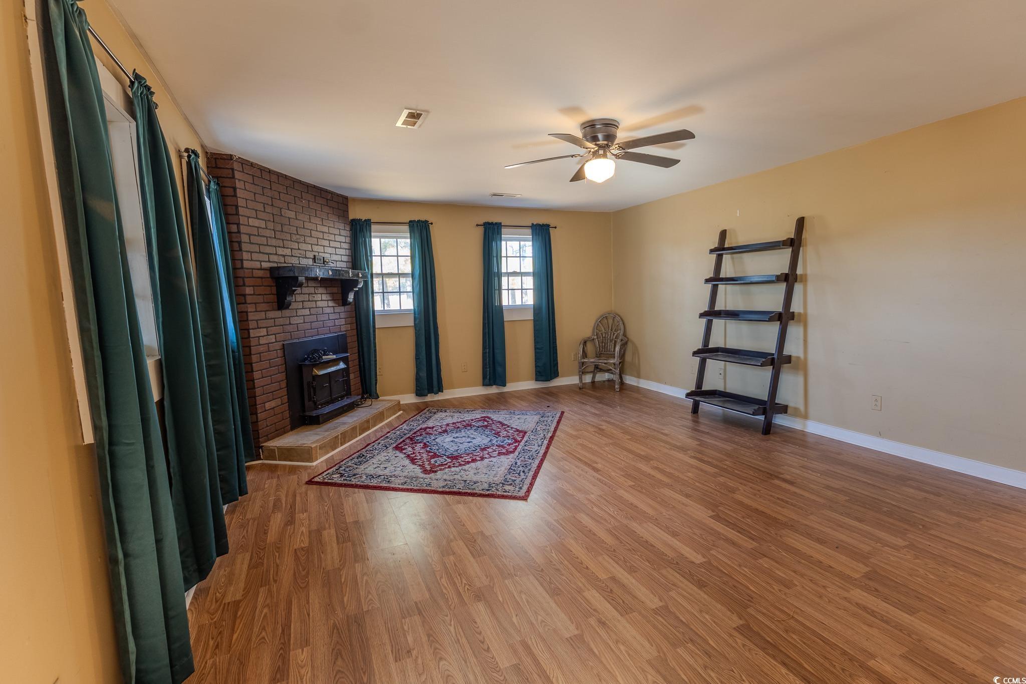 7755 Hunting Swamp Road Conway, SC 29527 - Photo 16 of 19 Full bath featuring vanity, shower / tub combo with curtain, and light tile patterned floors
