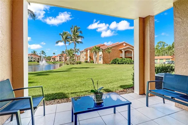 a view of a chairs and table in a yard