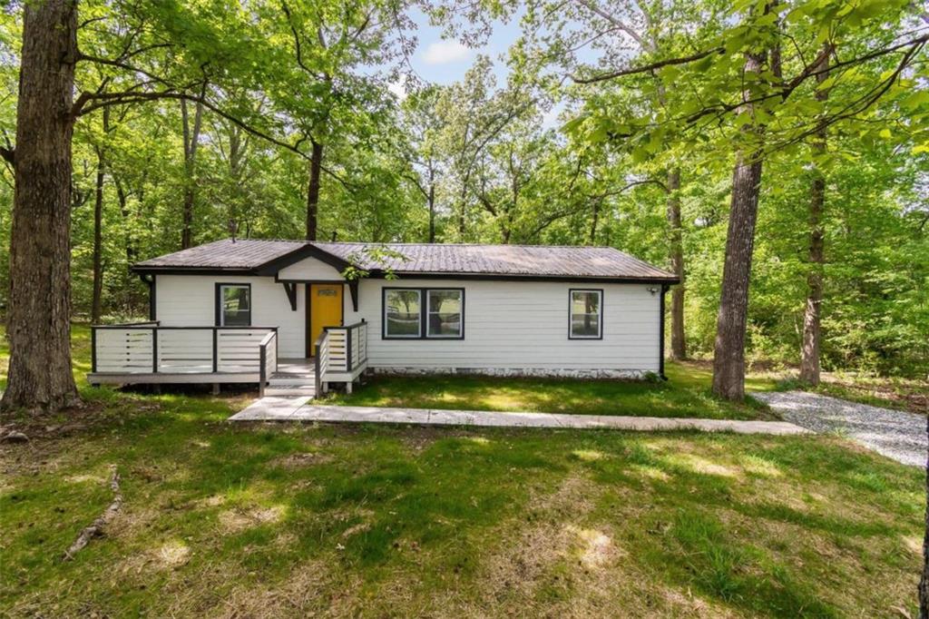 634 East Mays Road Stockbridge, GA 30281 - Photo 1 of 1 a backyard of a house with yard table and chairs