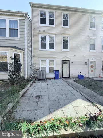 a front view of a house with a yard and a garage