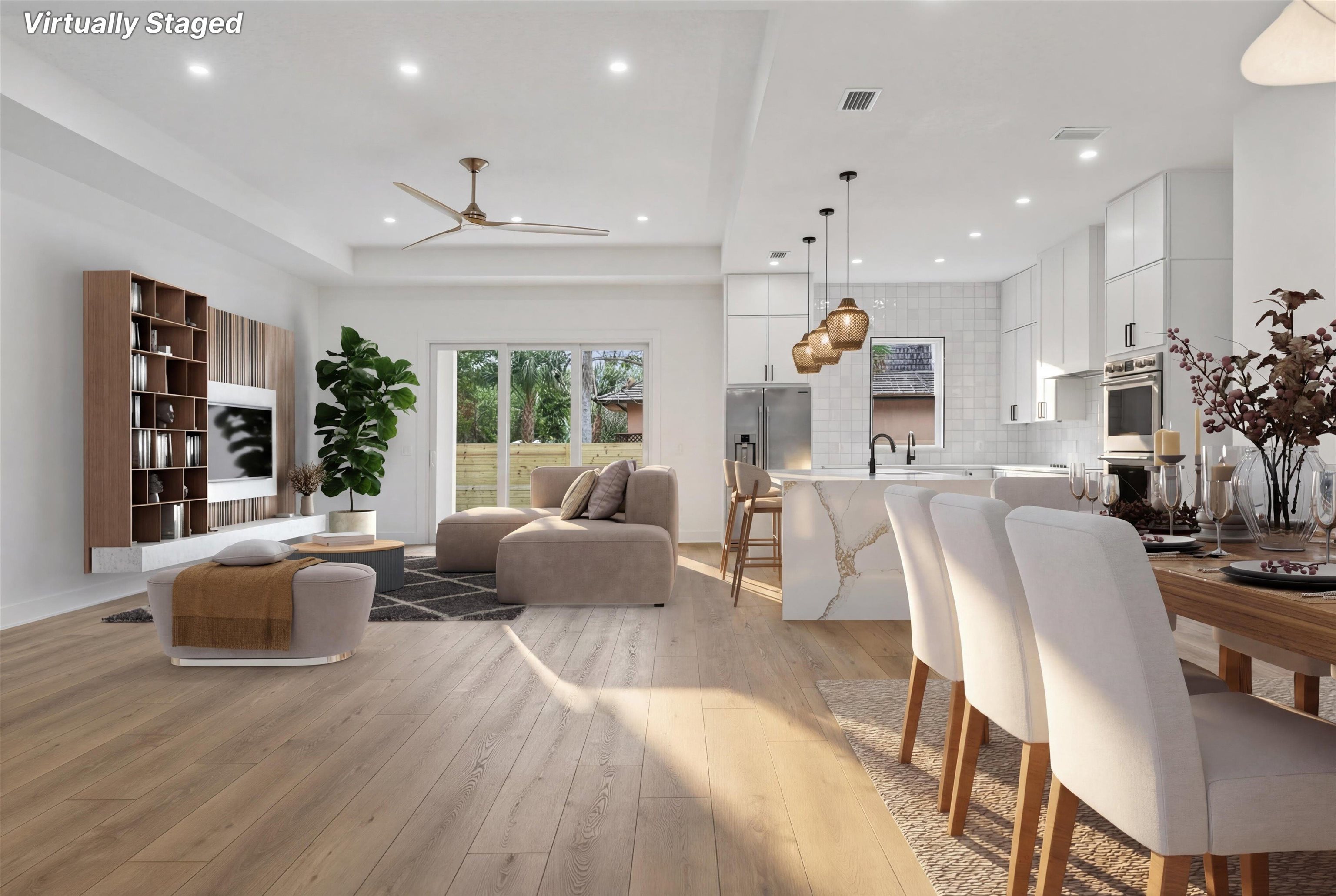 16 Baru Road St. Augustine, FL 32080 - Photo 11 of 73 Living area with light wood finished floors, a ceiling fan, and a raised ceiling