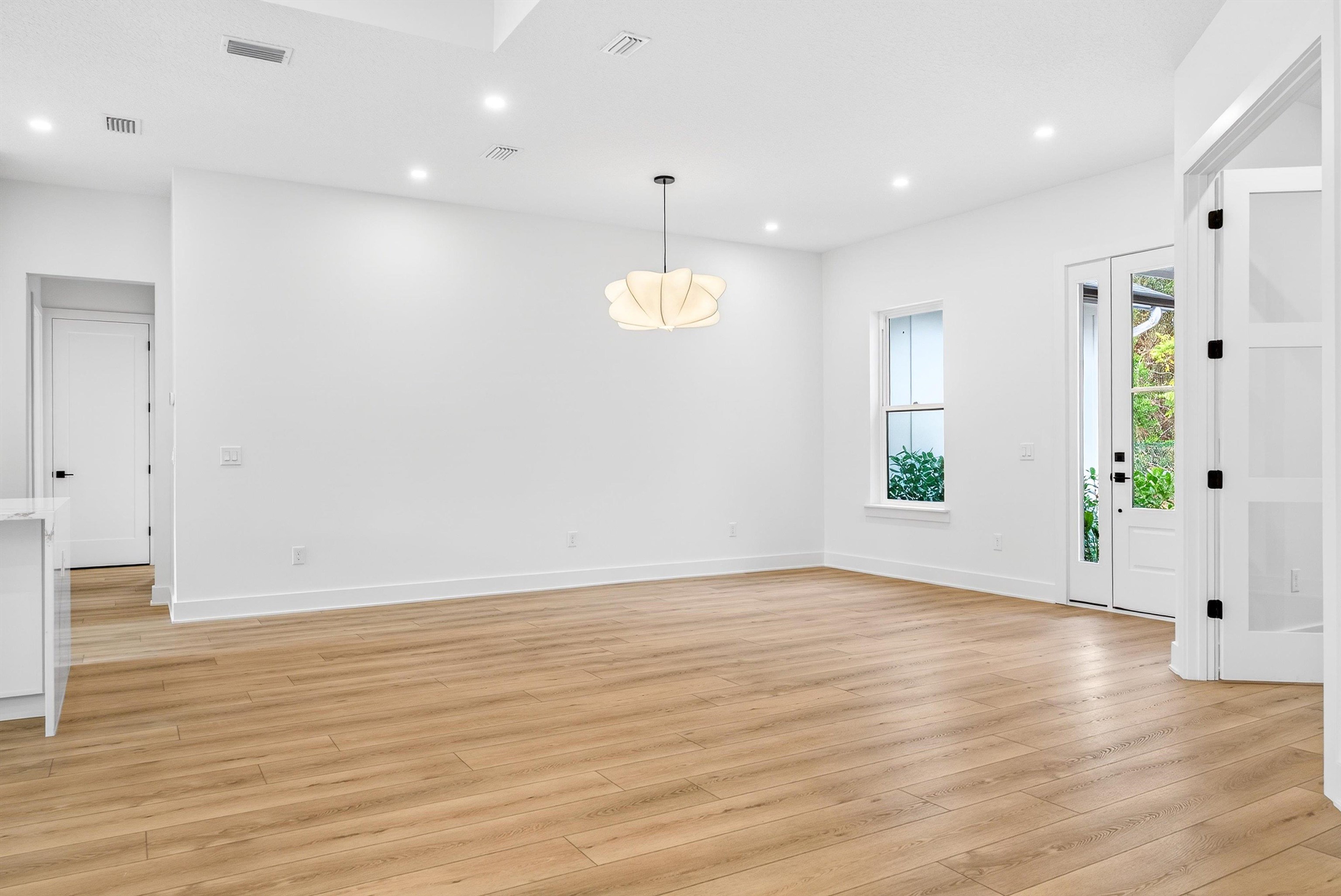 16 Baru Road St. Augustine, FL 32080 - Photo 14 of 73 an empty room with wooden floor and windows