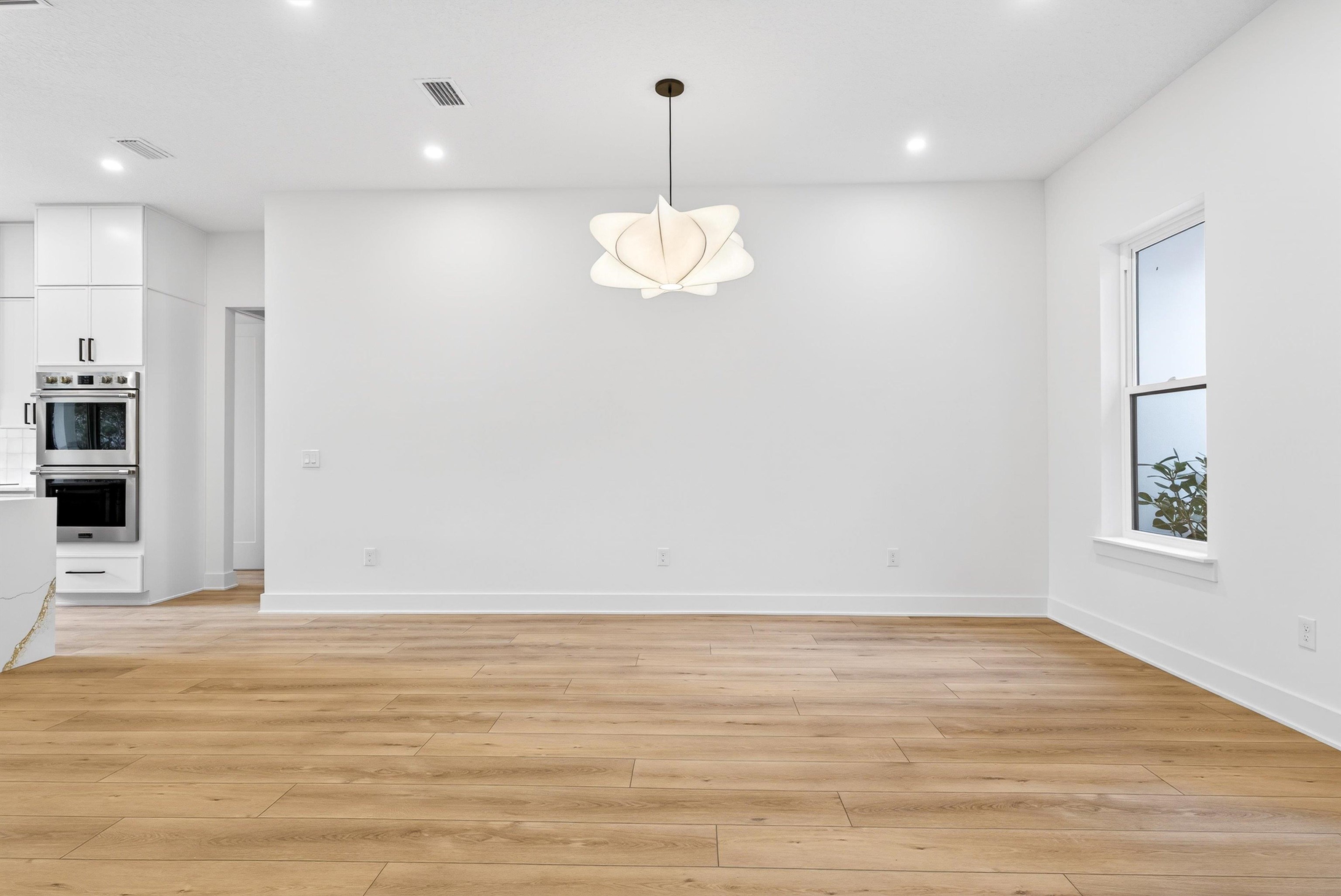 16 Baru Road St. Augustine, FL 32080 - Photo 15 of 73 a view of an empty room with wooden floor and a window