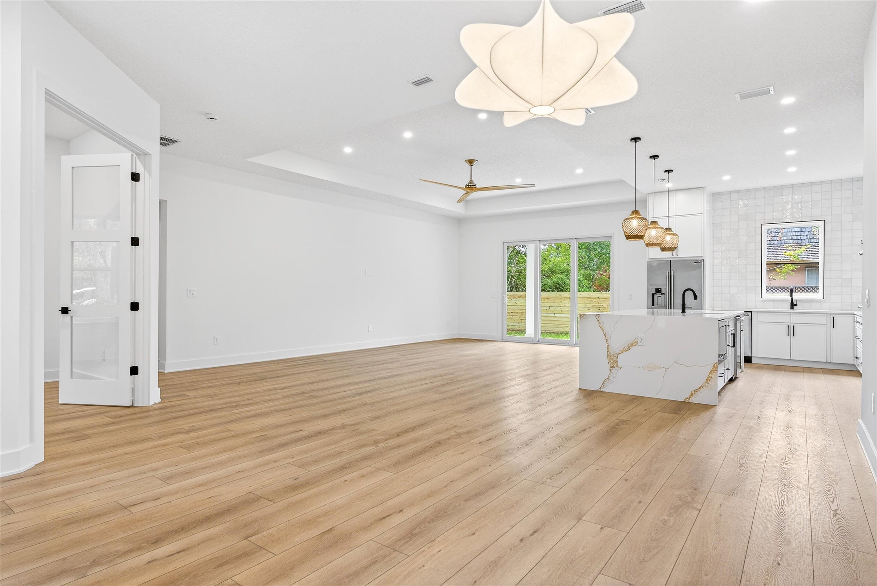 16 Baru Road St. Augustine, FL 32080 - Photo 17 of 73 a view of a livingroom with furniture wooden floor a chandelier