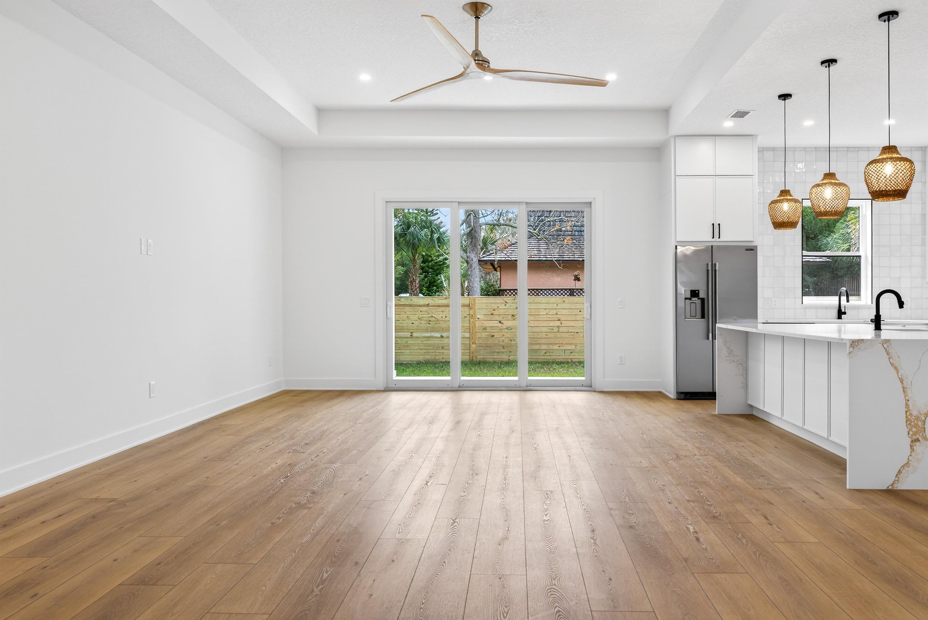 16 Baru Road St. Augustine, FL 32080 - Photo 19 of 73 a view of a room with wooden floor and sliding glass door