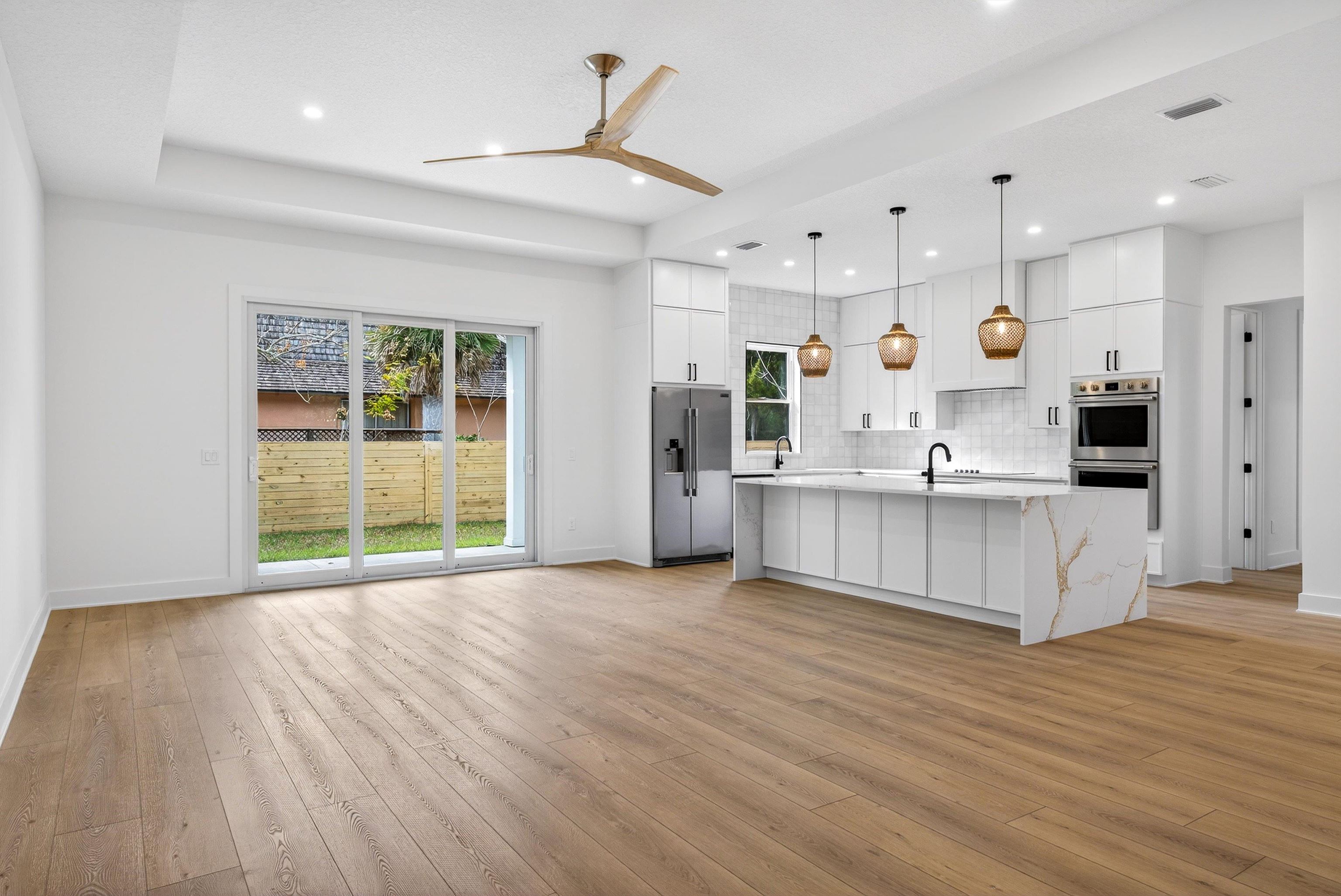 16 Baru Road St. Augustine, FL 32080 - Photo 72 of 73 a large kitchen with stainless steel appliances kitchen island a large counter top and a wooden floors