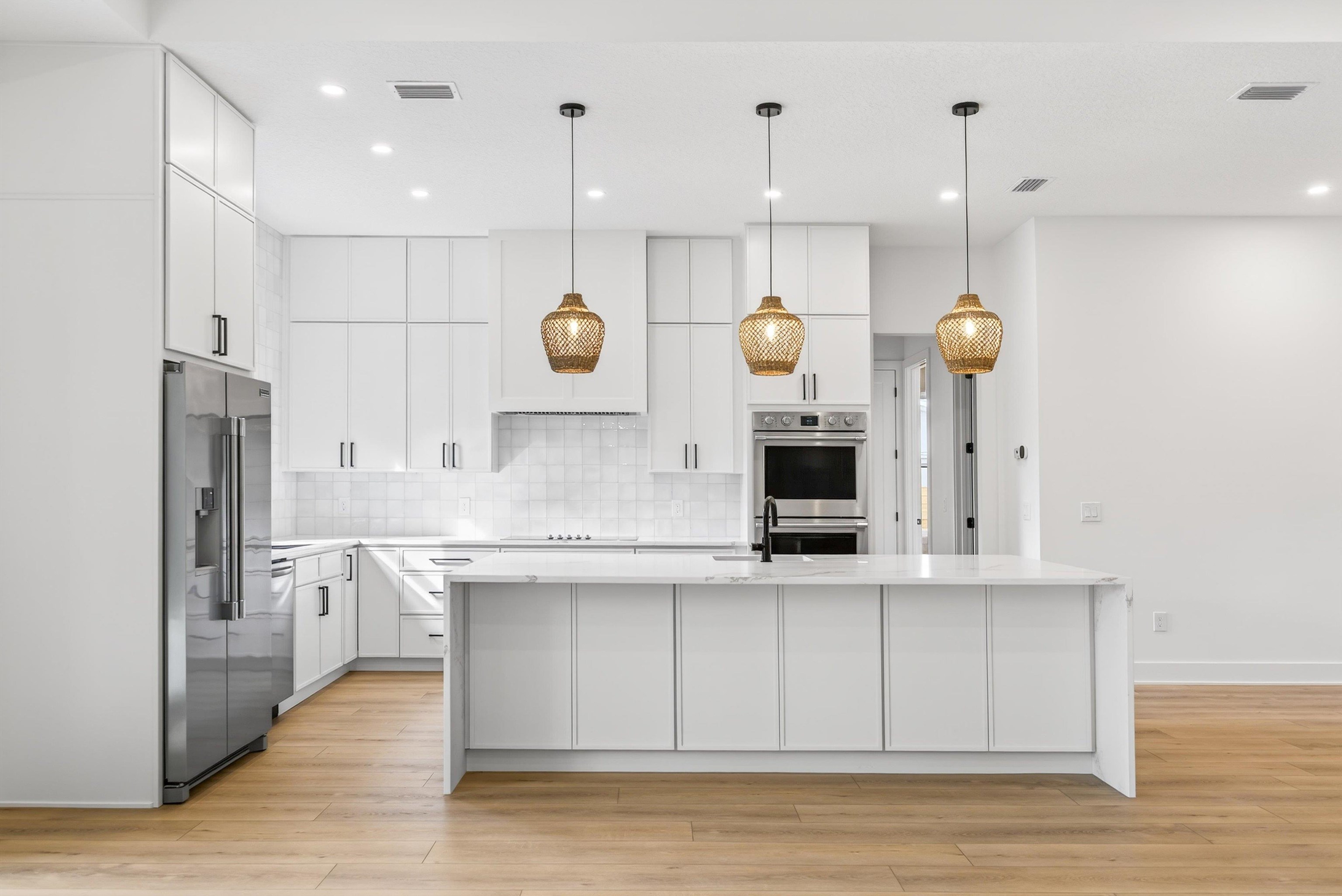 16 Baru Road St. Augustine, FL 32080 - Photo 20 of 73 a kitchen with a sink cabinets and stainless steel appliances