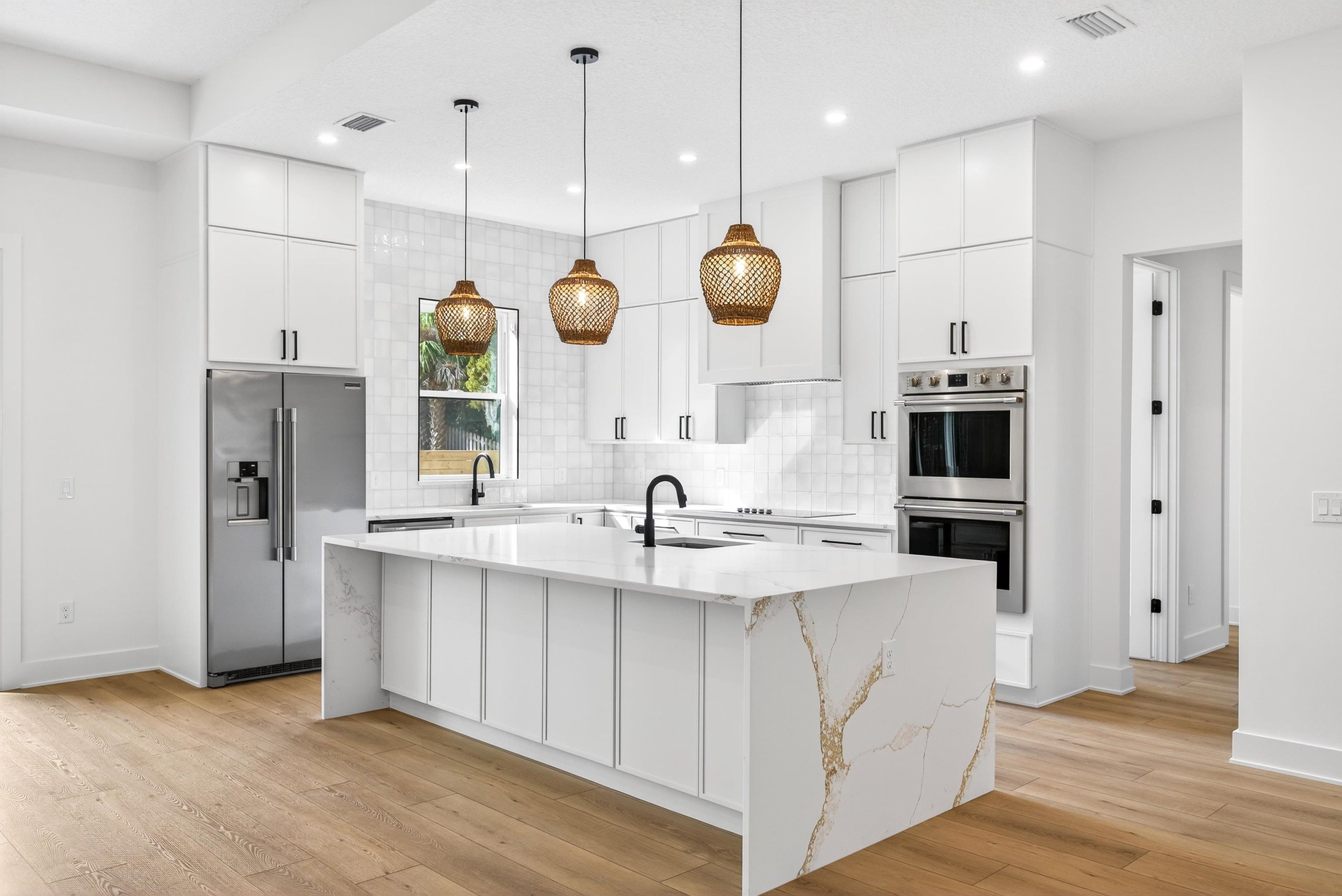 16 Baru Road St. Augustine, FL 32080 - Photo 21 of 73 an open kitchen with a sink and refrigerator