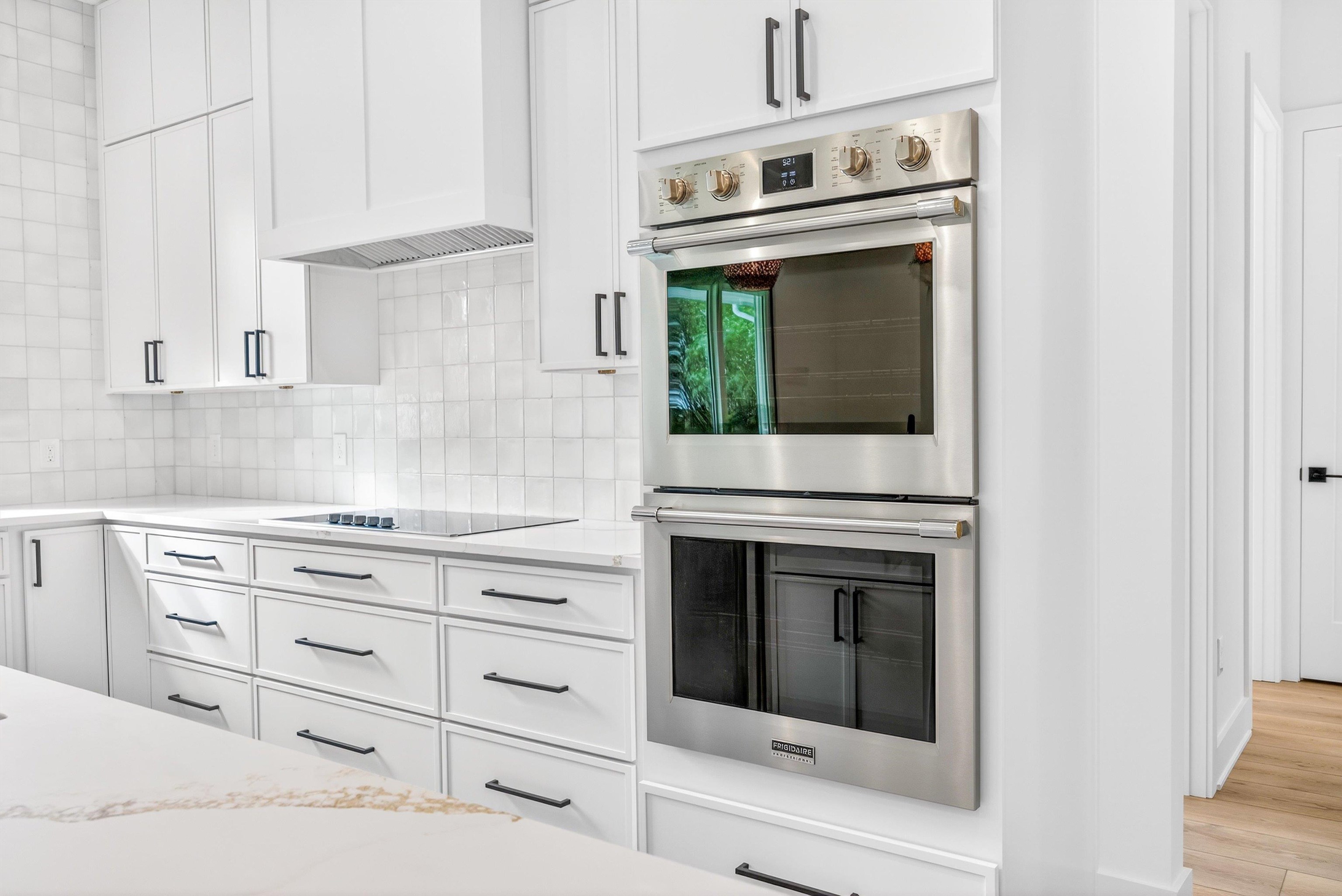 16 Baru Road St. Augustine, FL 32080 - Photo 27 of 73 a kitchen with granite countertop white cabinets and white appliances