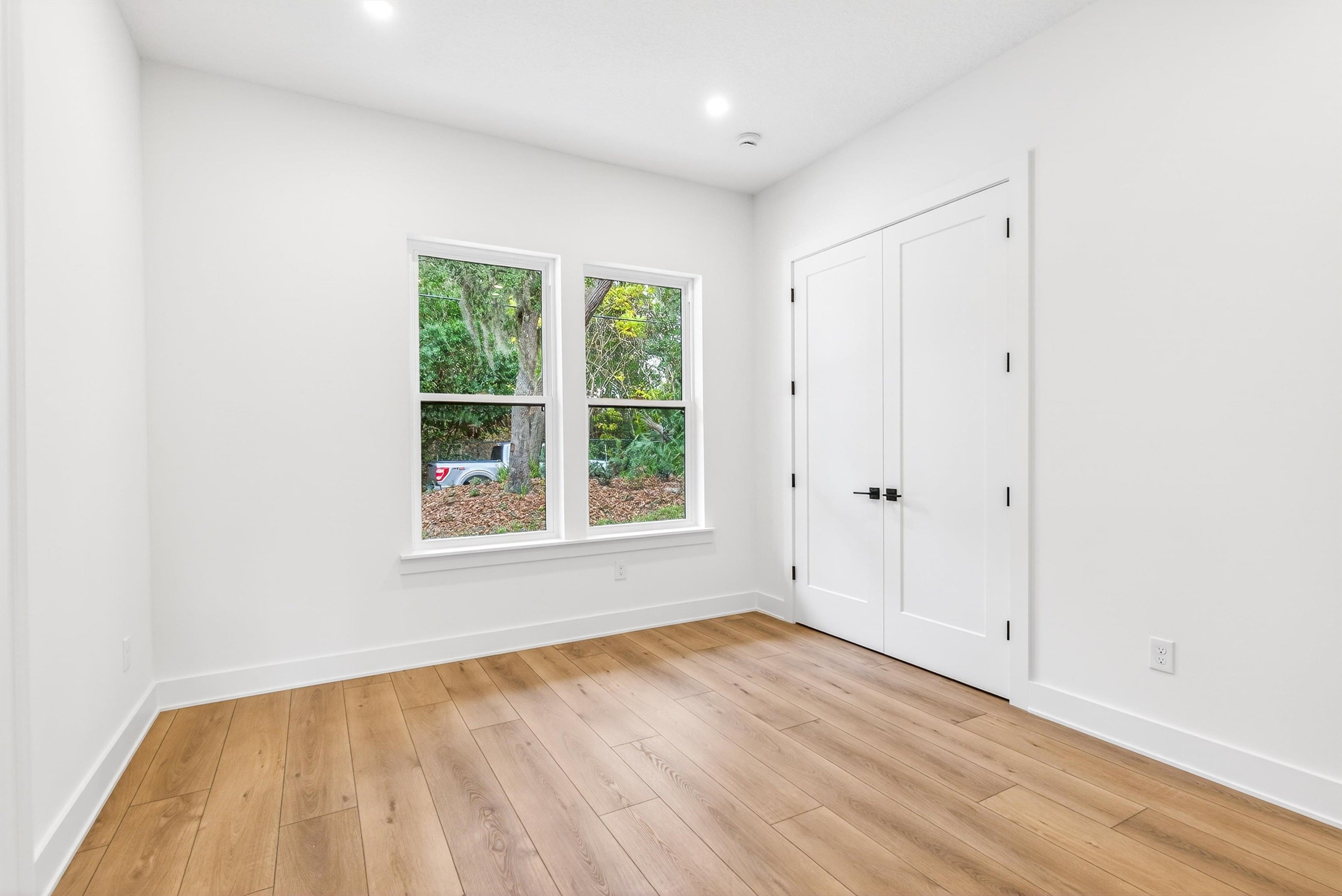16 Baru Road St. Augustine, FL 32080 - Photo 32 of 73 an empty room with wooden floor and windows