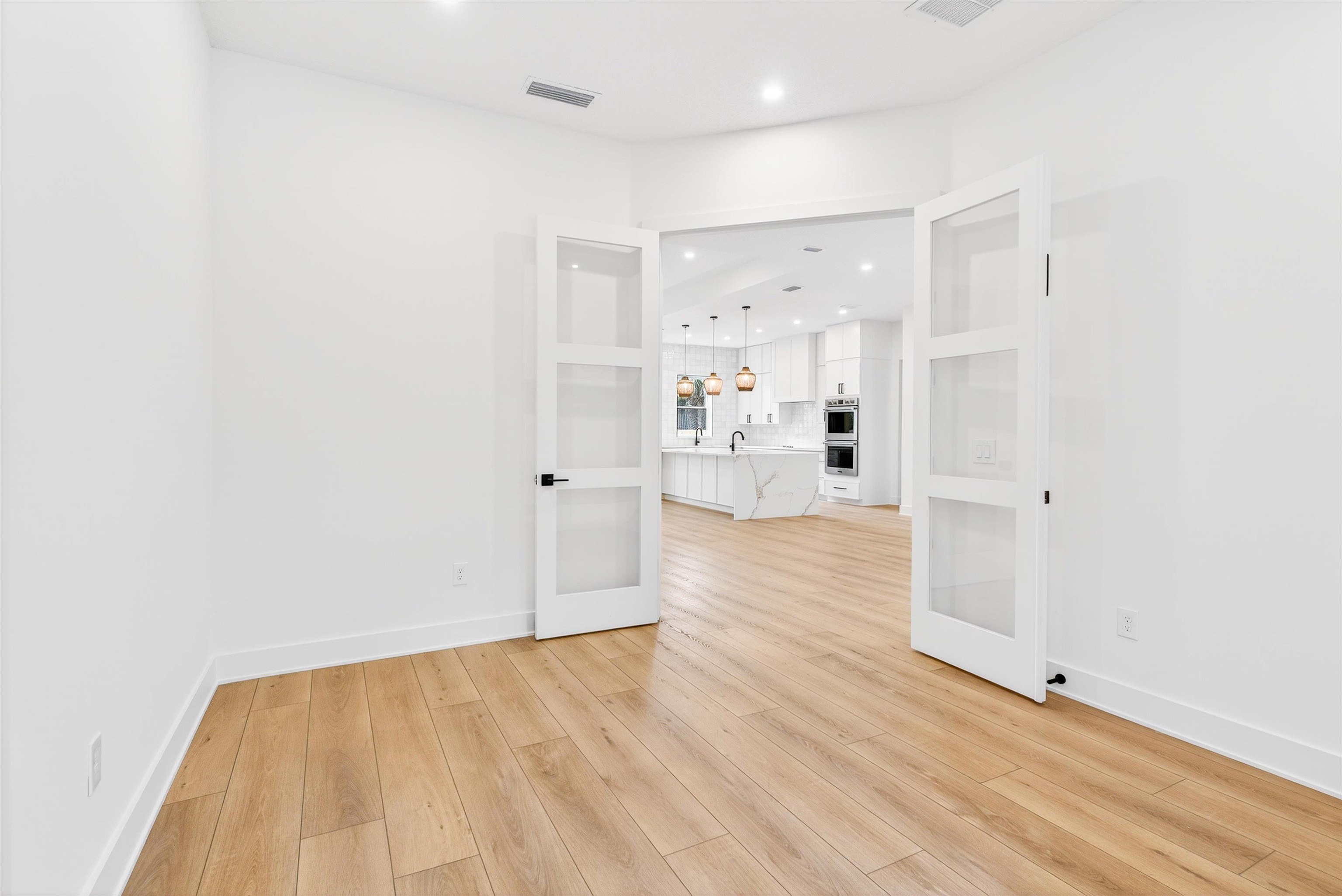 16 Baru Road St. Augustine, FL 32080 - Photo 33 of 73 a view of empty room with wooden floor