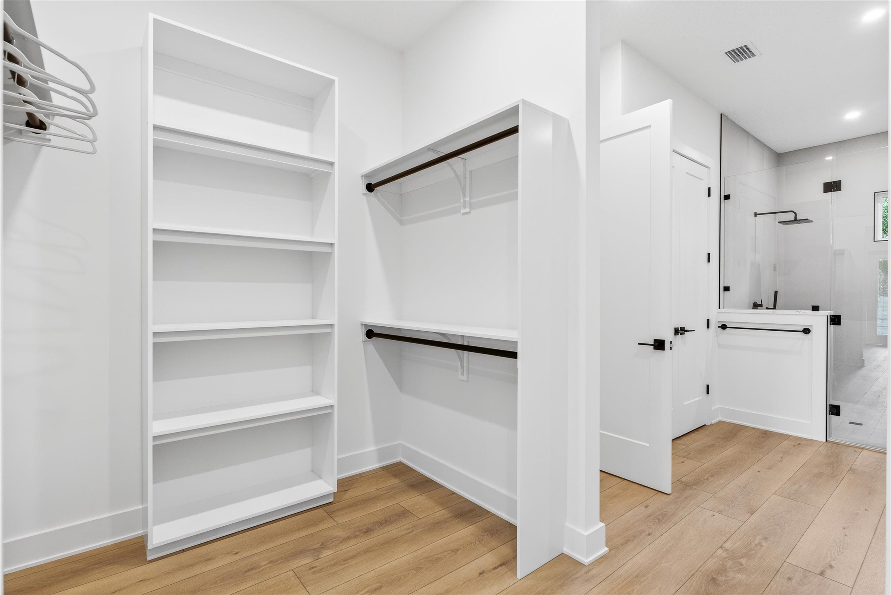 16 Baru Road St. Augustine, FL 32080 - Photo 36 of 73 a view of walk in closet with wooden floor