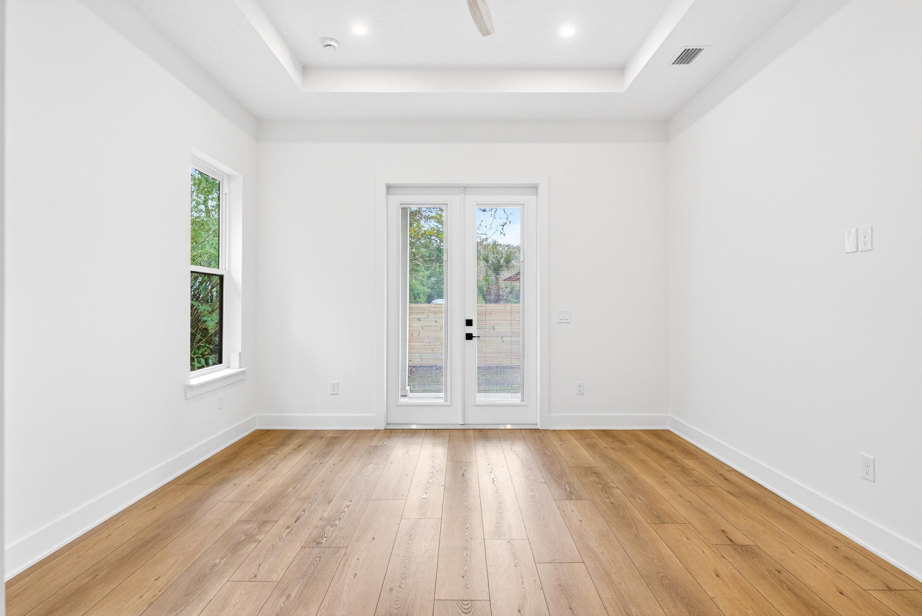 16 Baru Road St. Augustine, FL 32080 - Photo 37 of 73 an empty room with wooden floor and windows