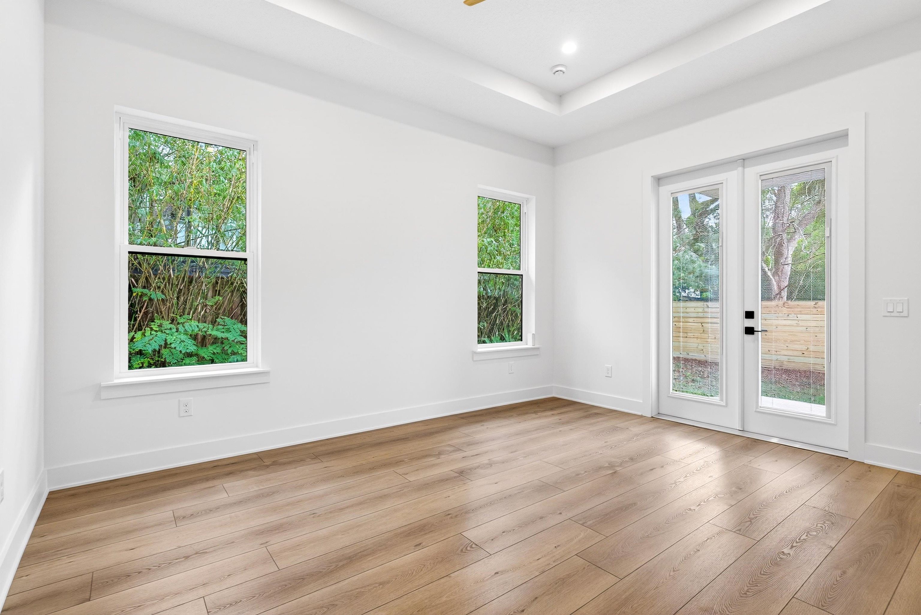 16 Baru Road St. Augustine, FL 32080 - Photo 38 of 73 an empty room with wooden floor and windows