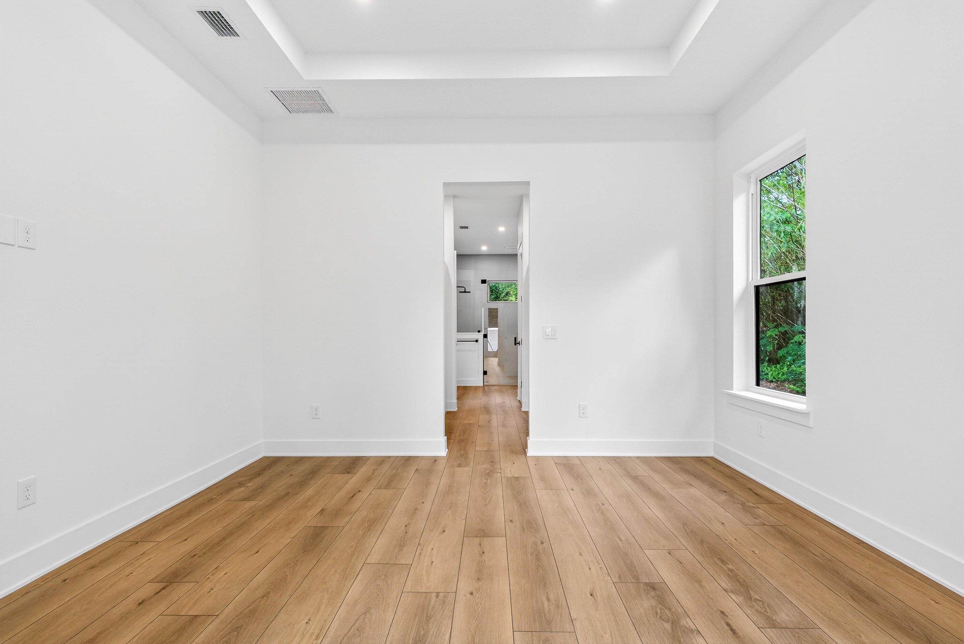 16 Baru Road St. Augustine, FL 32080 - Photo 39 of 73 an empty room with wooden floor and windows