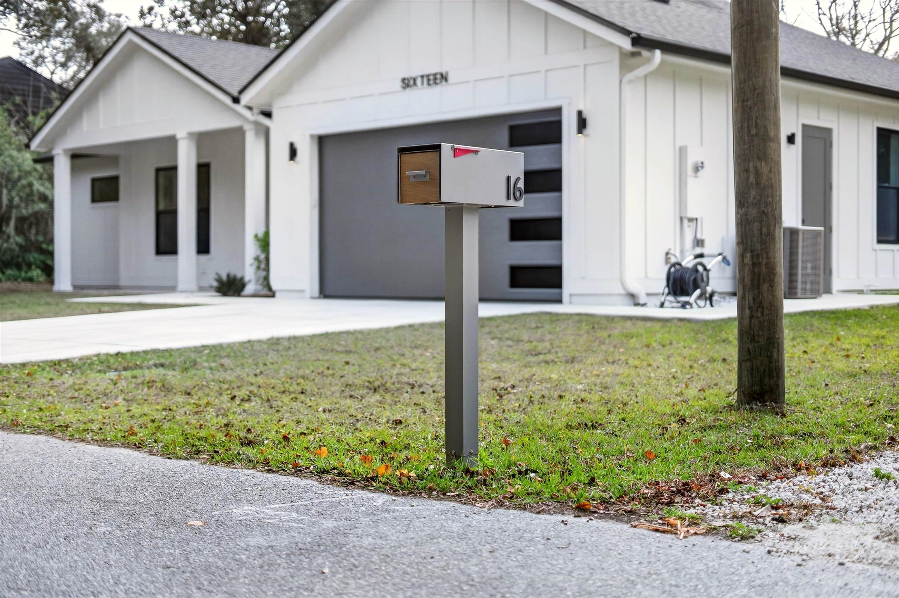 16 Baru Road St. Augustine, FL 32080 - Photo 5 of 73 Modern farmhouse featuring board and batten siding, concrete driveway, roof with shingles, and an attached garage