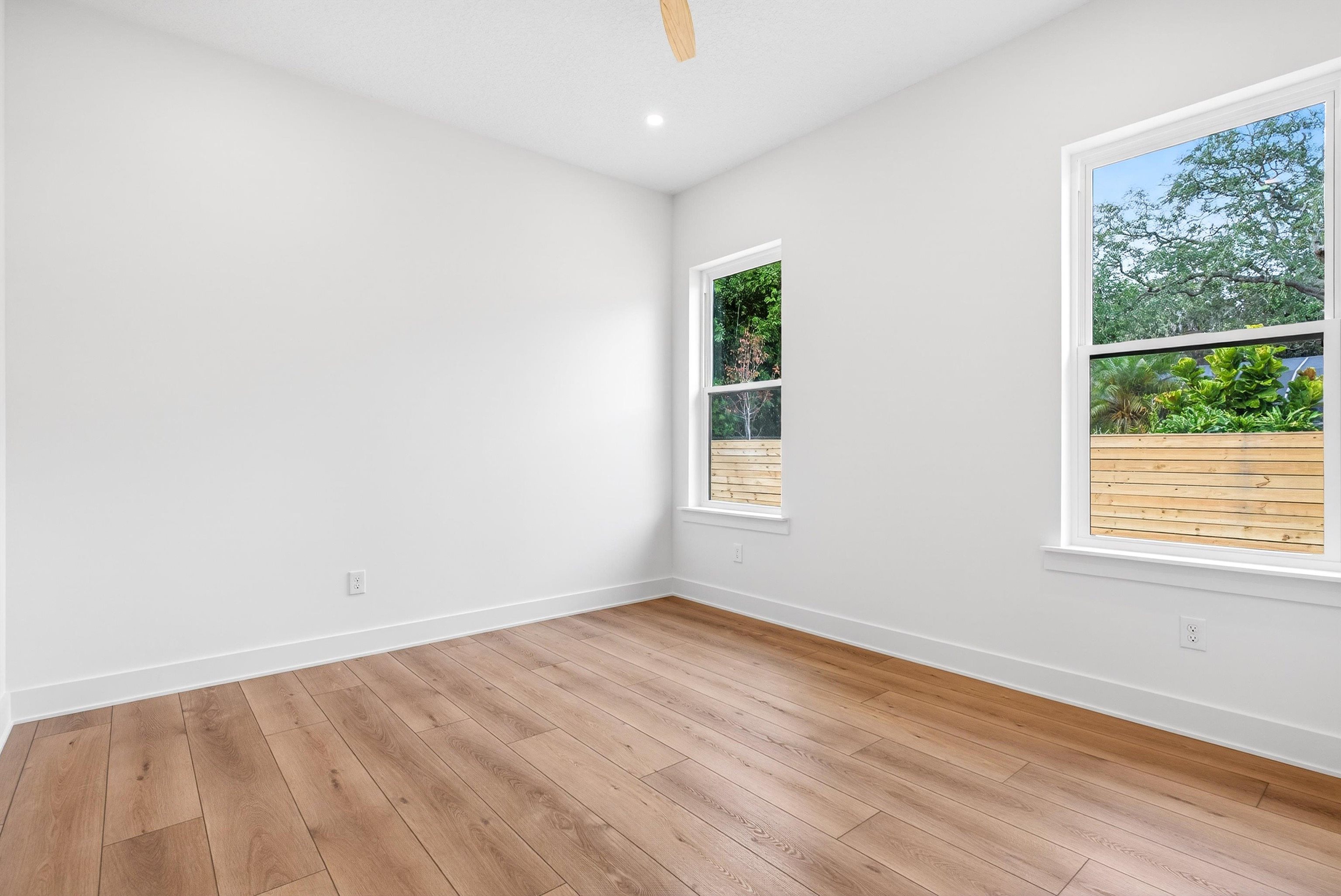 16 Baru Road St. Augustine, FL 32080 - Photo 49 of 73 an empty room with wooden floor and windows