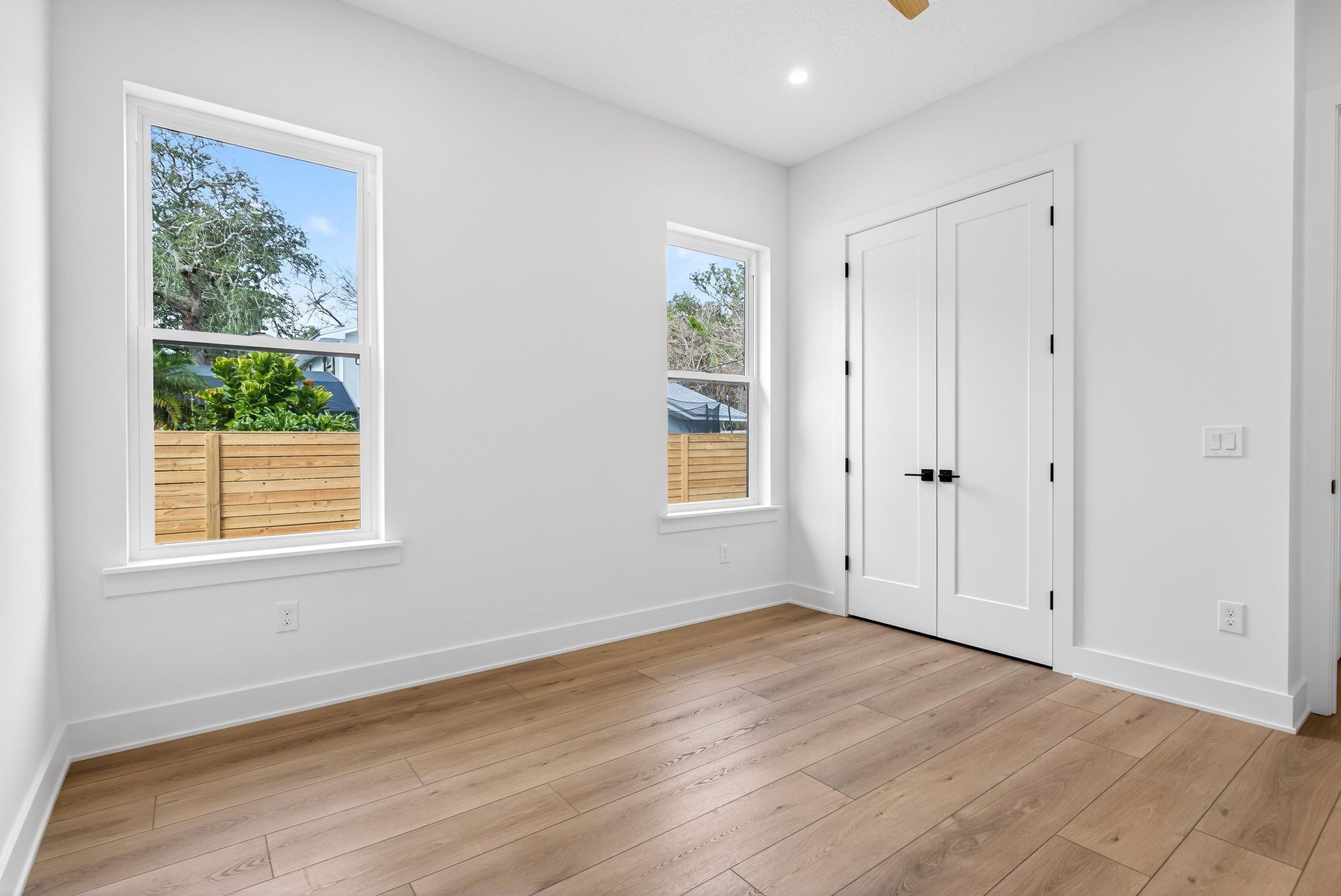16 Baru Road St. Augustine, FL 32080 - Photo 50 of 73 an empty room with wooden floor and windows