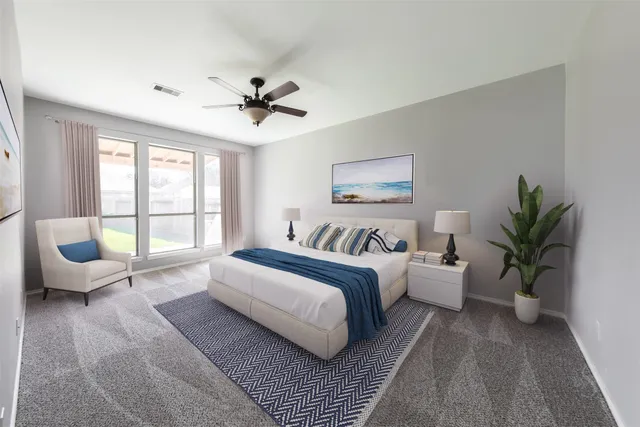 a spacious bedroom with a large bed and a couch