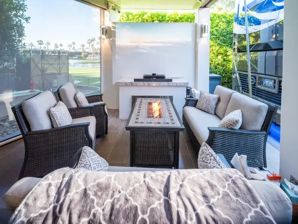 a bedroom with furniture and a fireplace