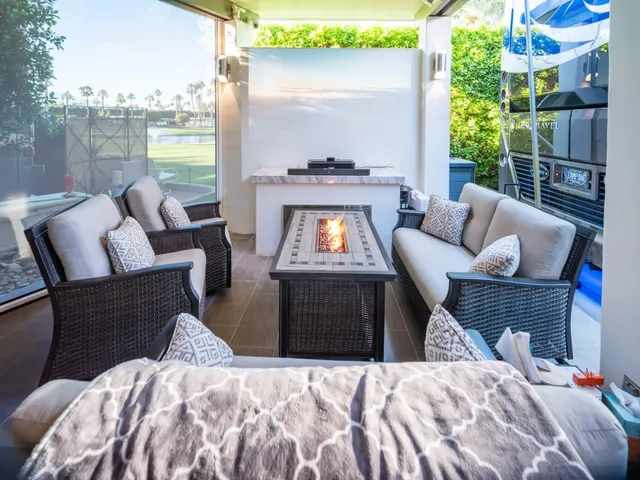 a bedroom with furniture and a fireplace