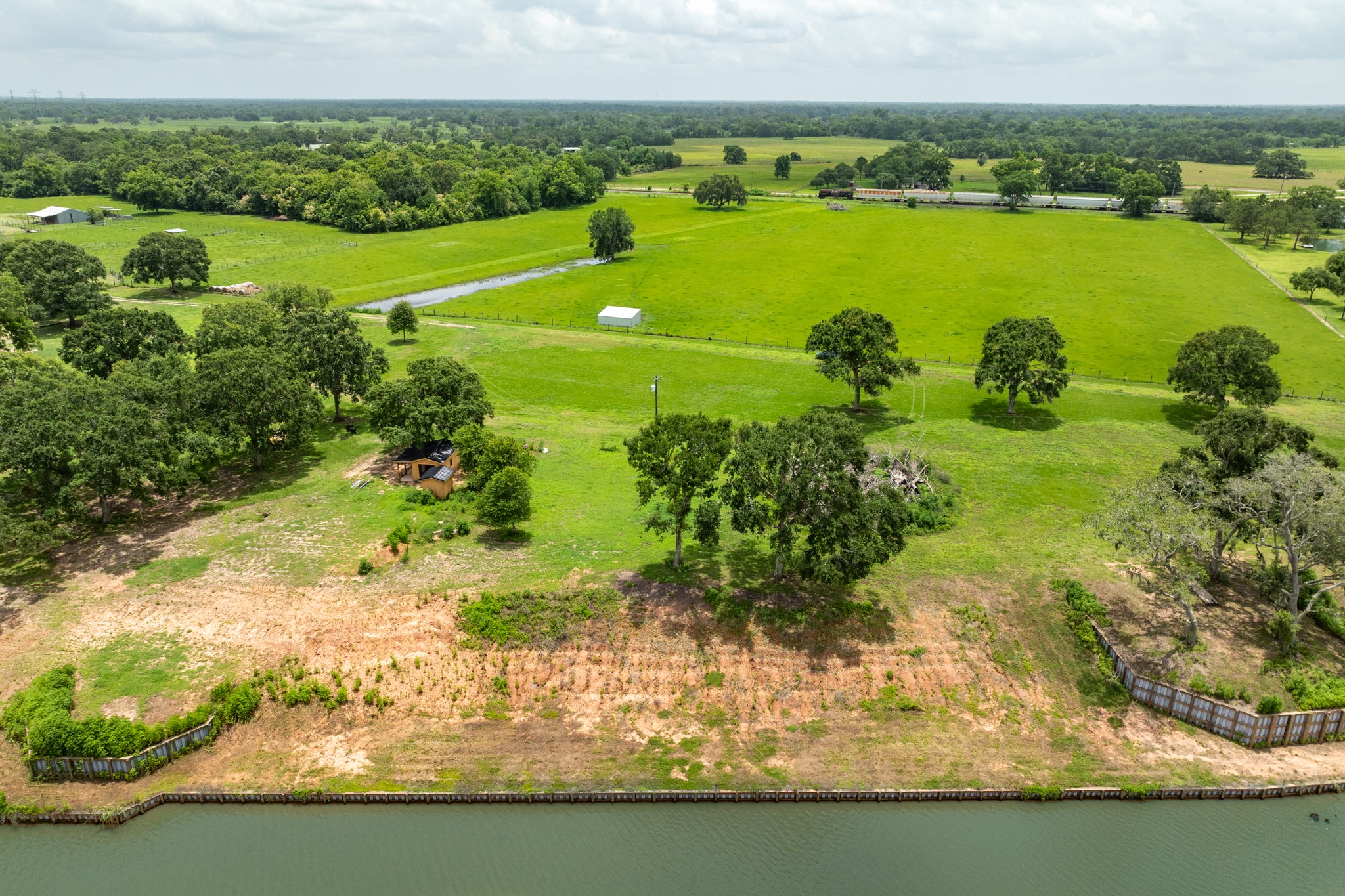 2 County Road 344 Sweeny, TX 77480 - Photo 12 of 20 a view of a lake with a city