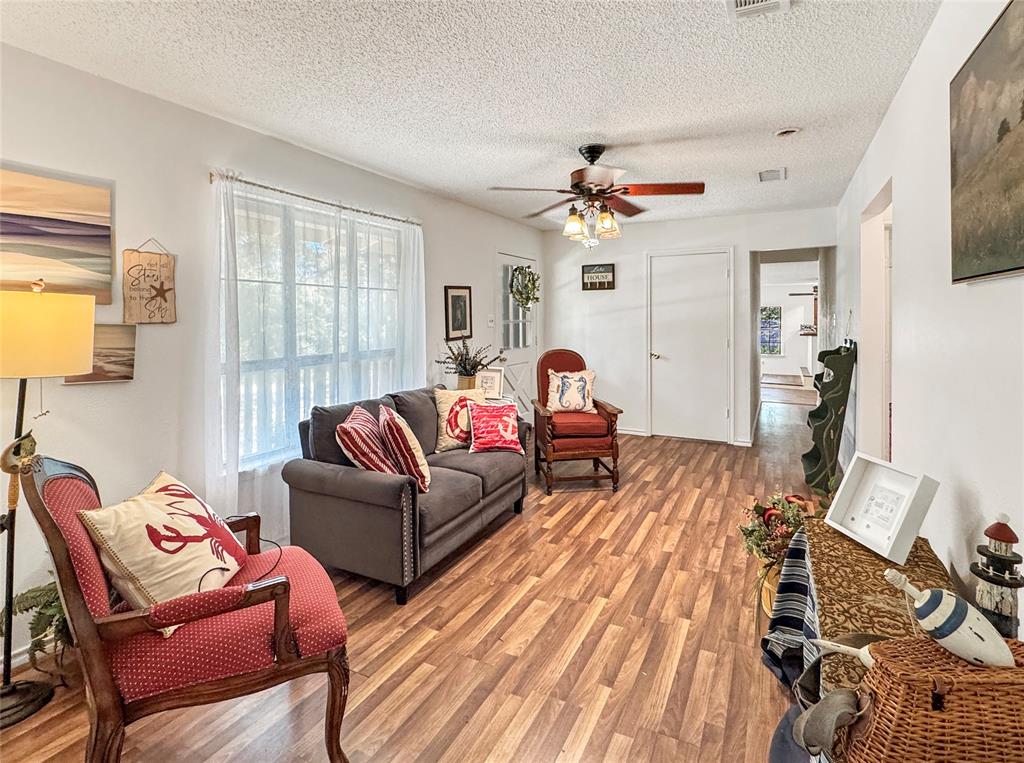 1005 Wood Canyon Road Tool, TX 75143 - Photo 11 of 26 a living room with furniture a flat screen tv and a window