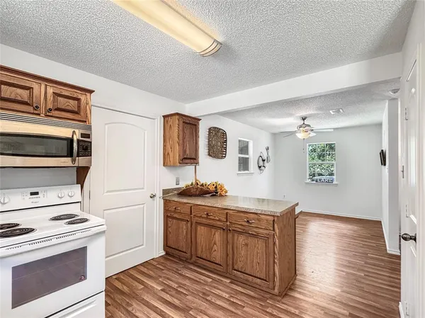 a kitchen with a stove and a microwave