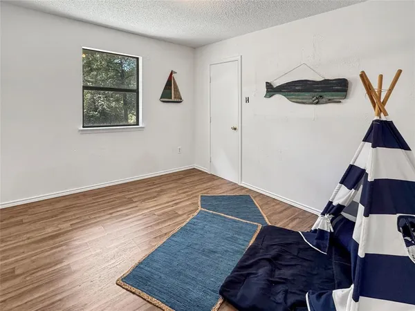 a view of entryway with wooden floor