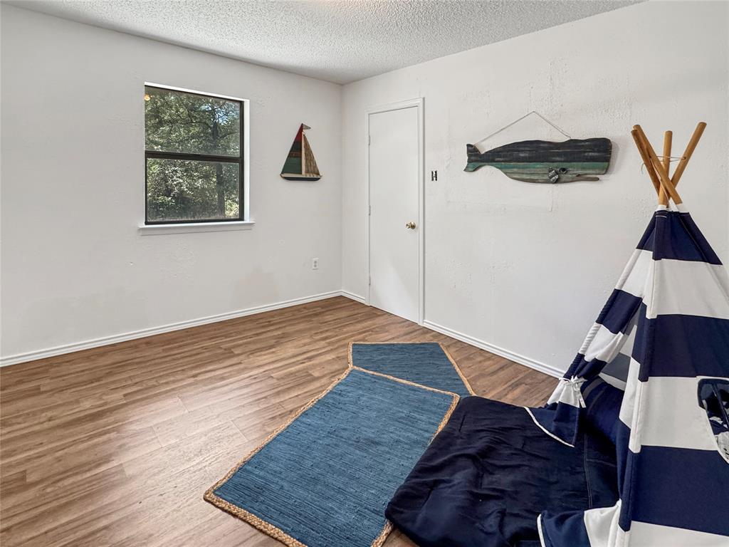 1005 Wood Canyon Road Tool, TX 75143 - Photo 18 of 26 a view of entryway with wooden floor