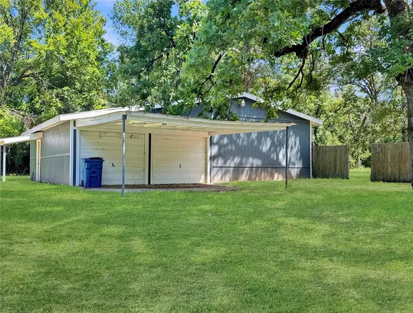 a backyard of a house with lots of green space