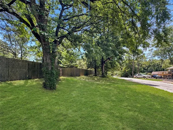 a backyard of a house with lots of green space