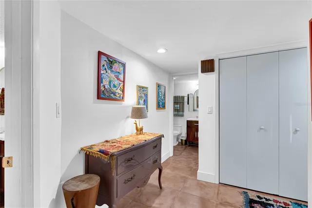 a room with furniture and air conditioner vent