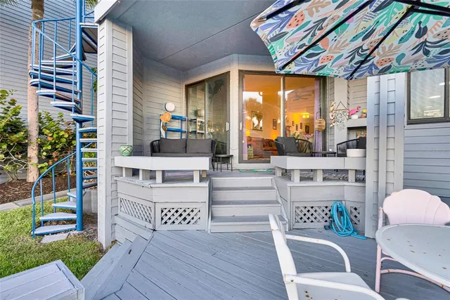 a backyard of a house with outdoor seating