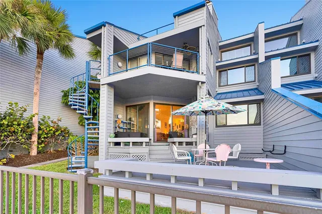 a terrace with outdoor seating and city view