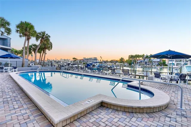 a view of a swimming pool with a lounge chair