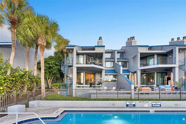 a view of a swimming pool with chairs