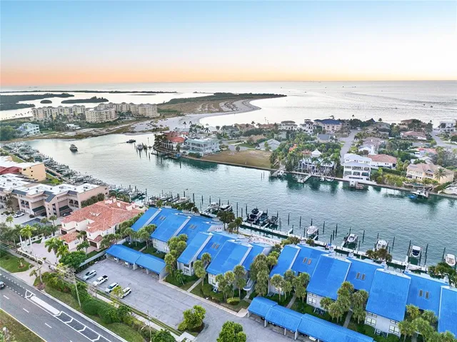 an aerial view of a houses with a lake view