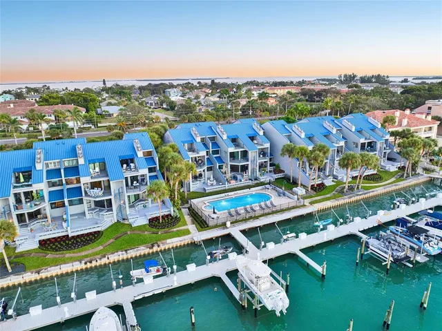 aerial view of a house with swimming pool and outdoor seating
