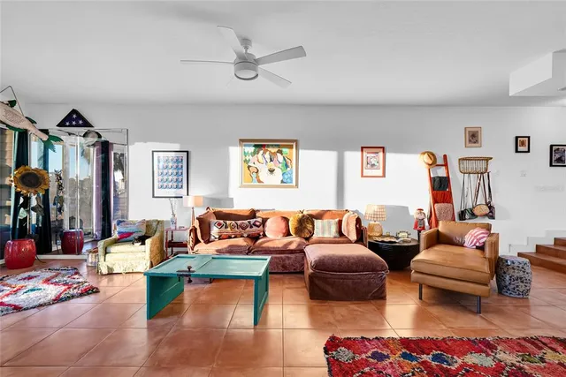 a living room with furniture and a rug